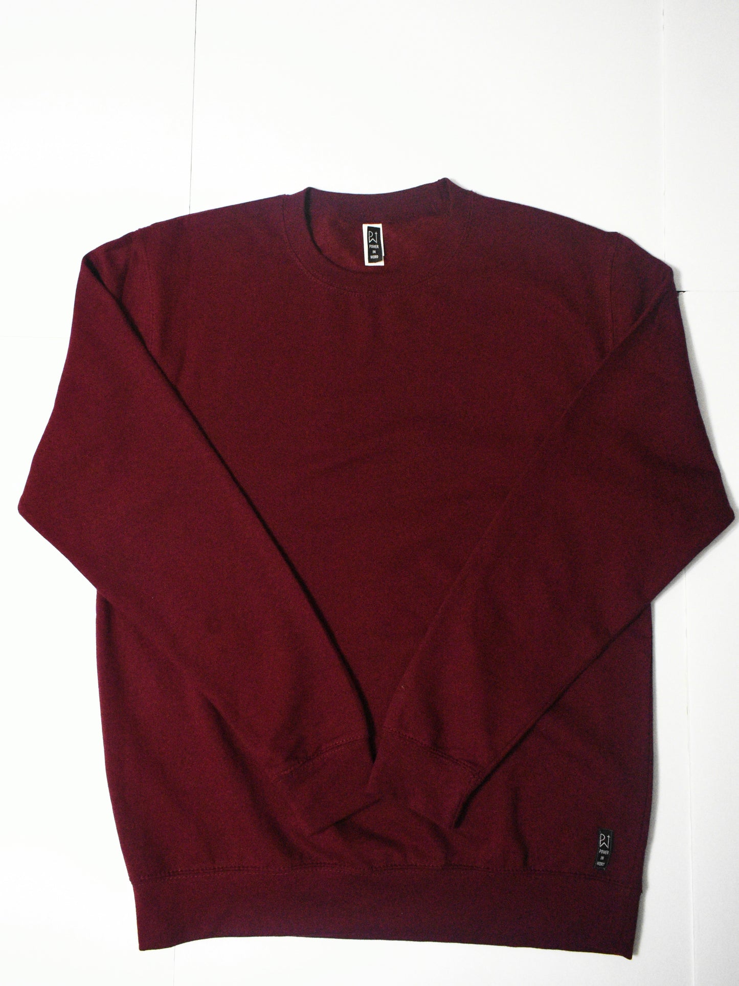 Burgundy Sweatshirt Front with woven label in bottom left corner